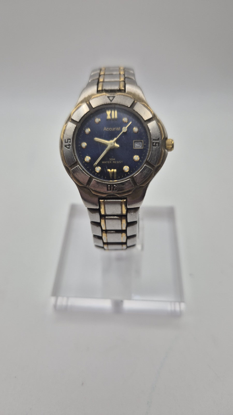 Accurist watch with a blue dial and two-tone bracelet.0