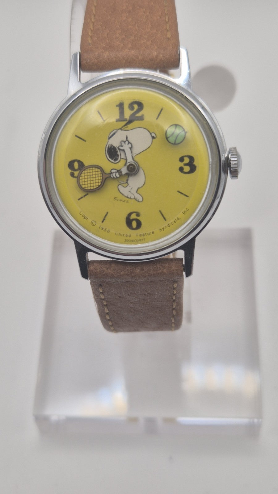 Vintage Timex Snoopy "Tennis" watch features a yellow dial with a mechanical...2