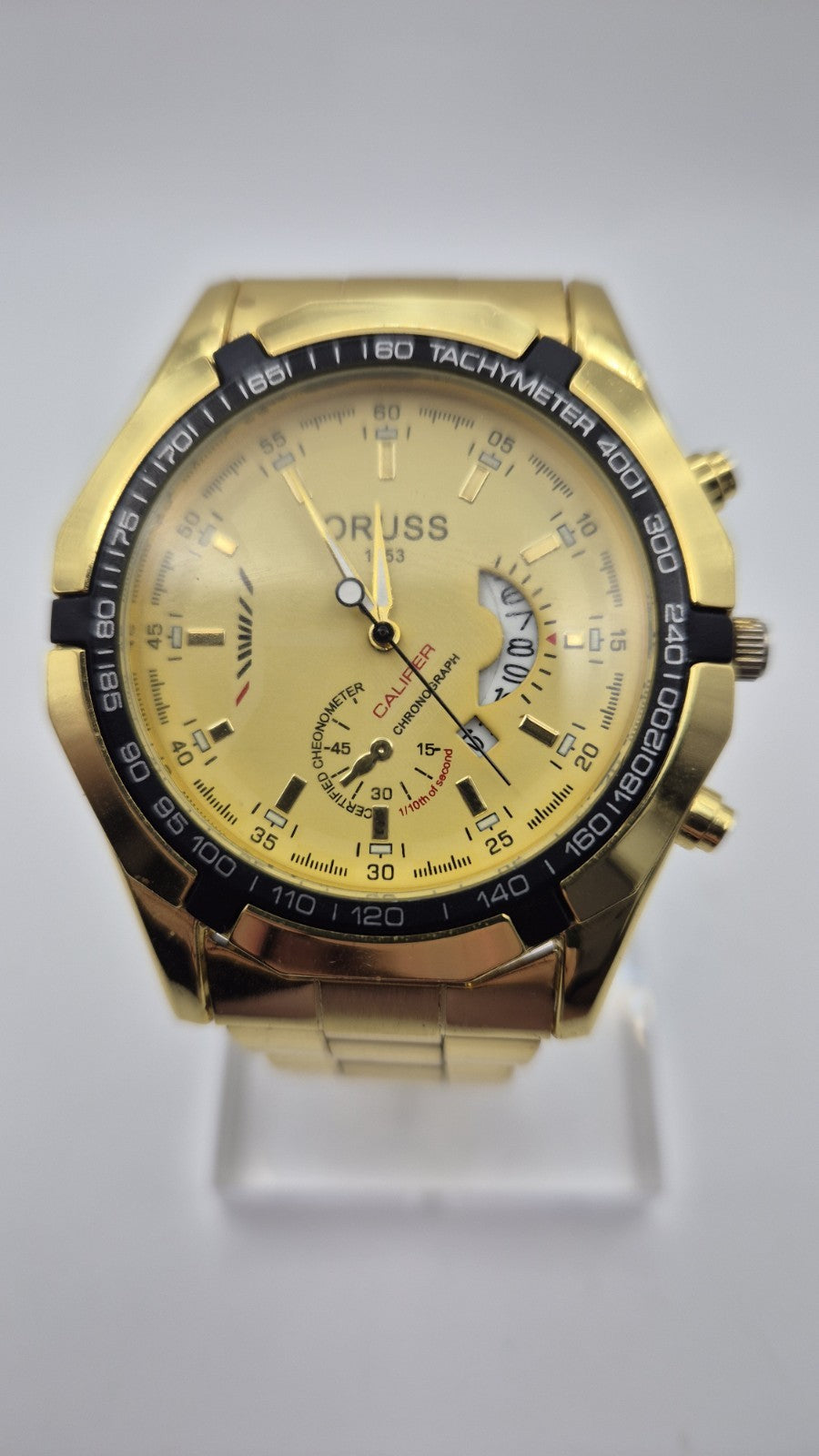 Oruss 1853 men's gold-tone quartz chronograph watch featuring a black tachymetre1