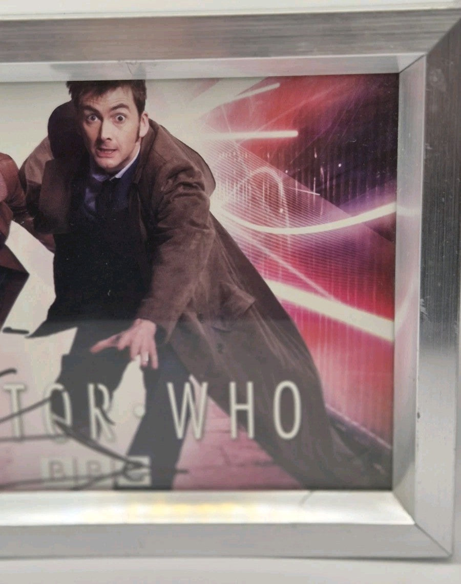 Framed promotional photograph of the Tenth Doctor (played by David Tennant) and5