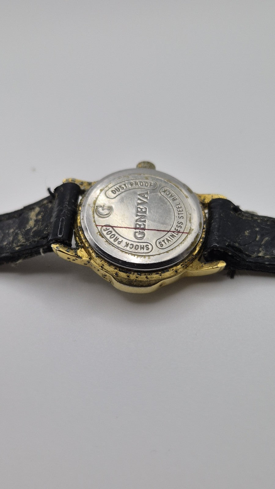 Geneva women's quartz watch with a green dial and goldtone case.8