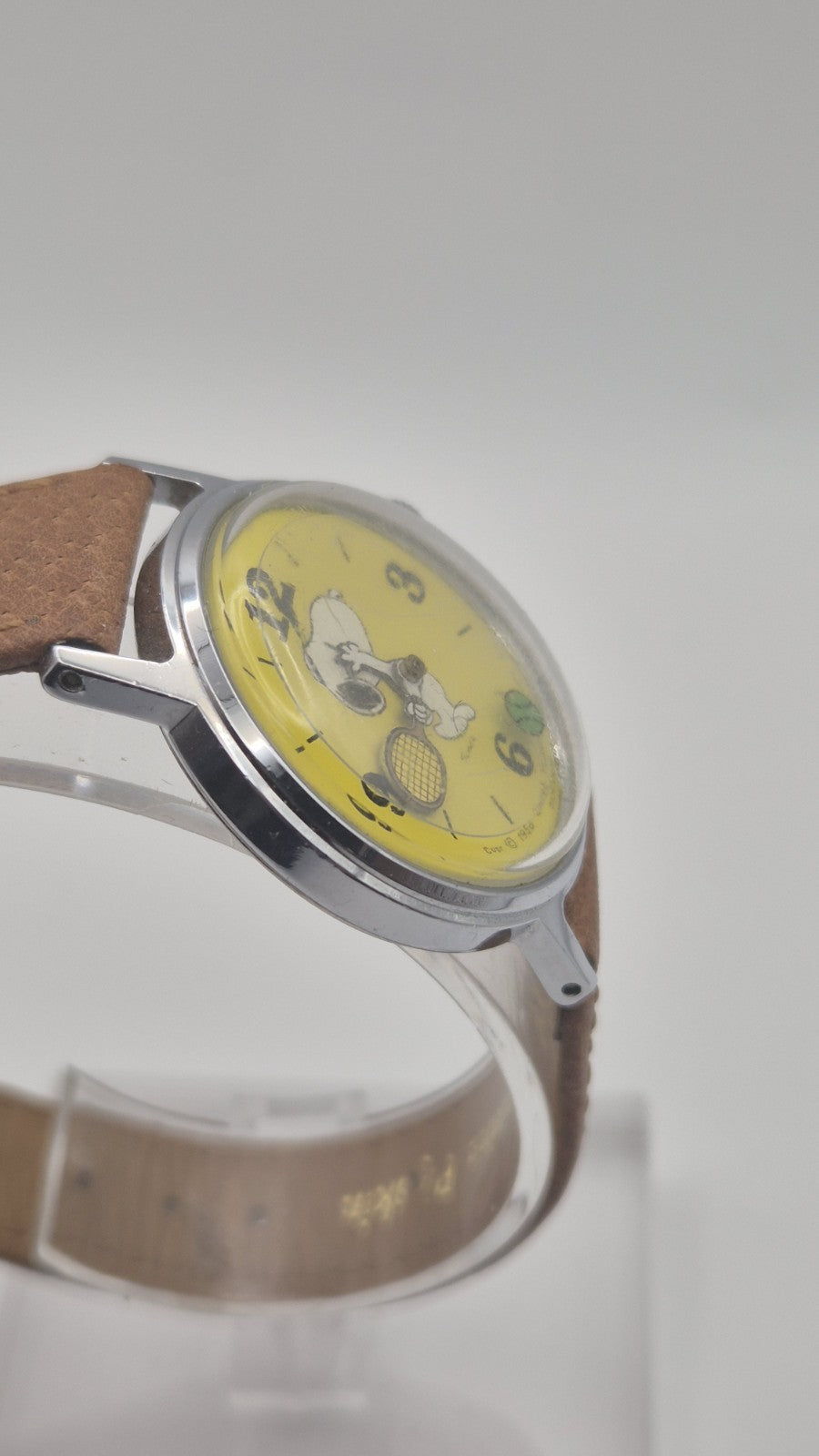 Vintage Timex Snoopy "Tennis" watch features a yellow dial with a mechanical...4