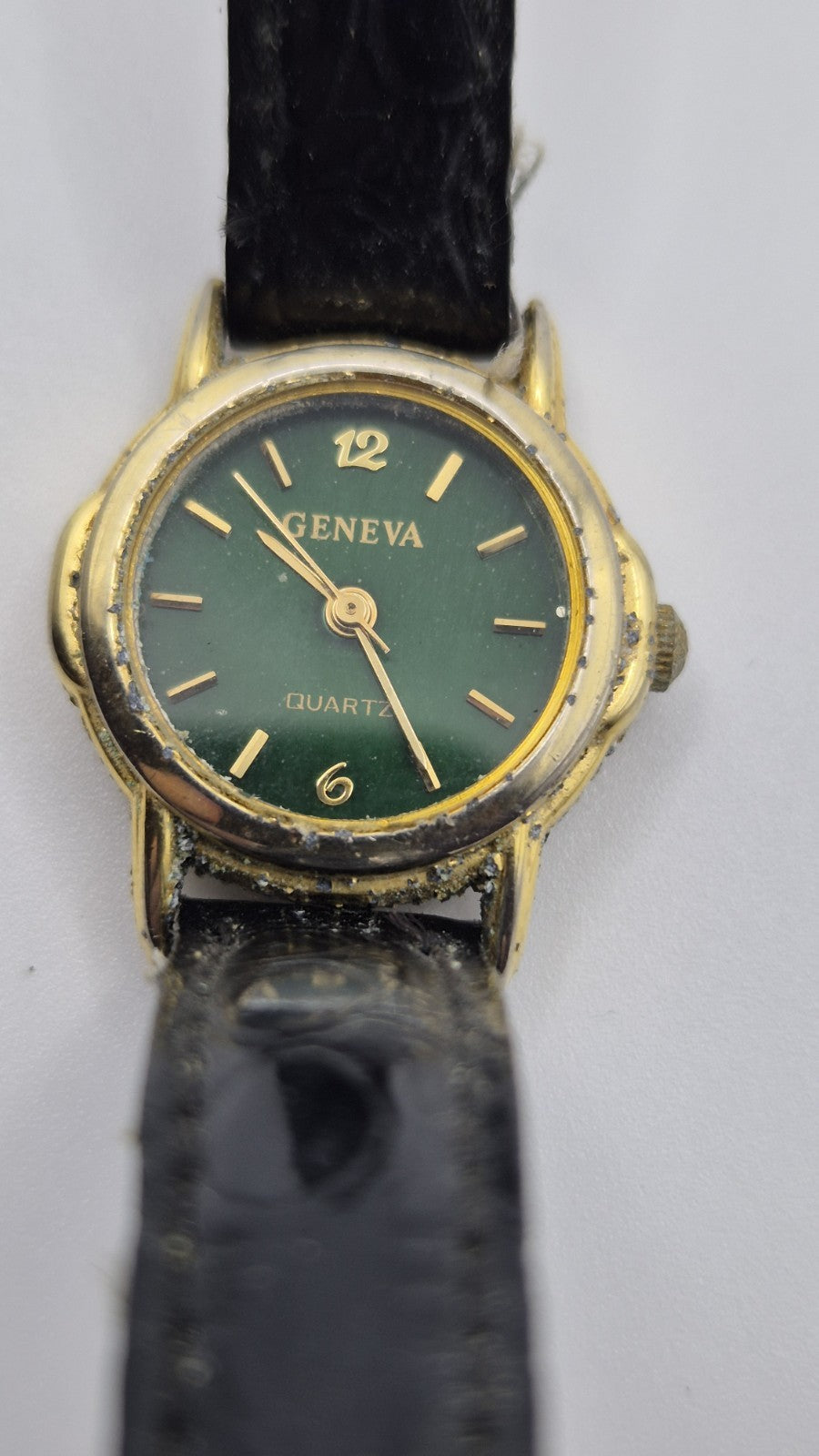 Geneva women's quartz watch with a green dial and goldtone case.0