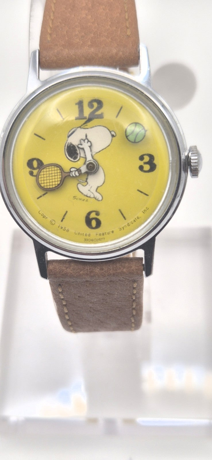 Vintage Timex Snoopy "Tennis" watch features a yellow dial with a mechanical...0