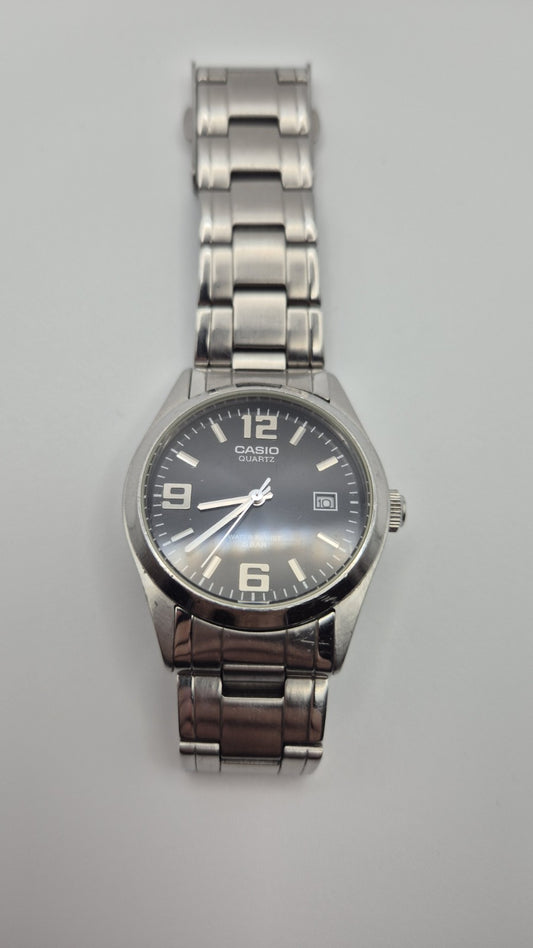 Casio MTP1181 watch with a black dial and stainless steel band0