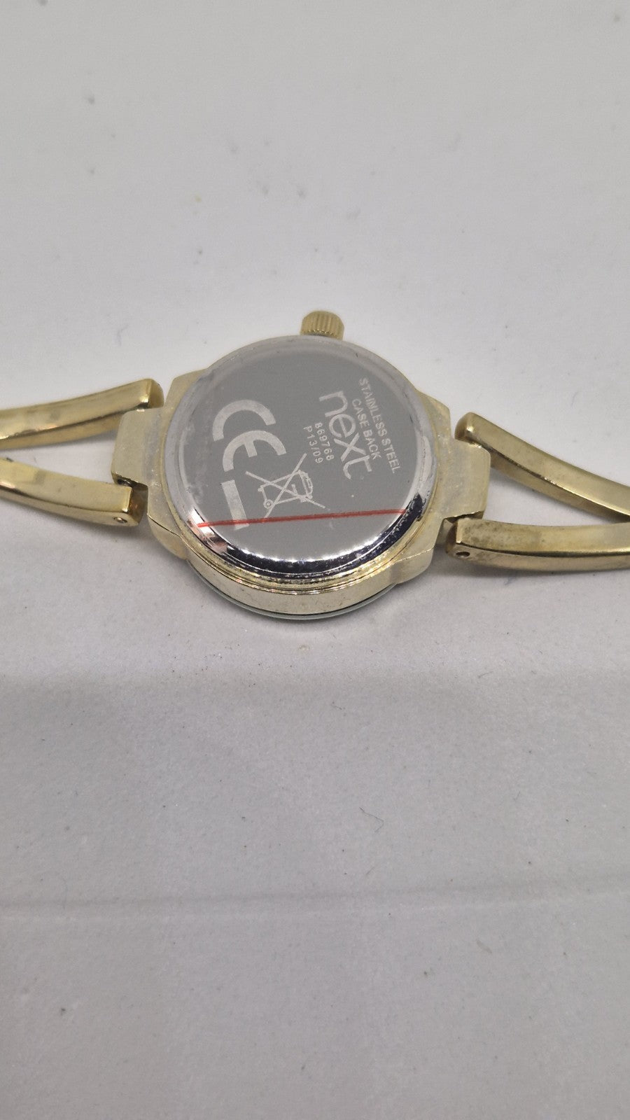Next women's watch with a goldtone band and a crystalembellished case12