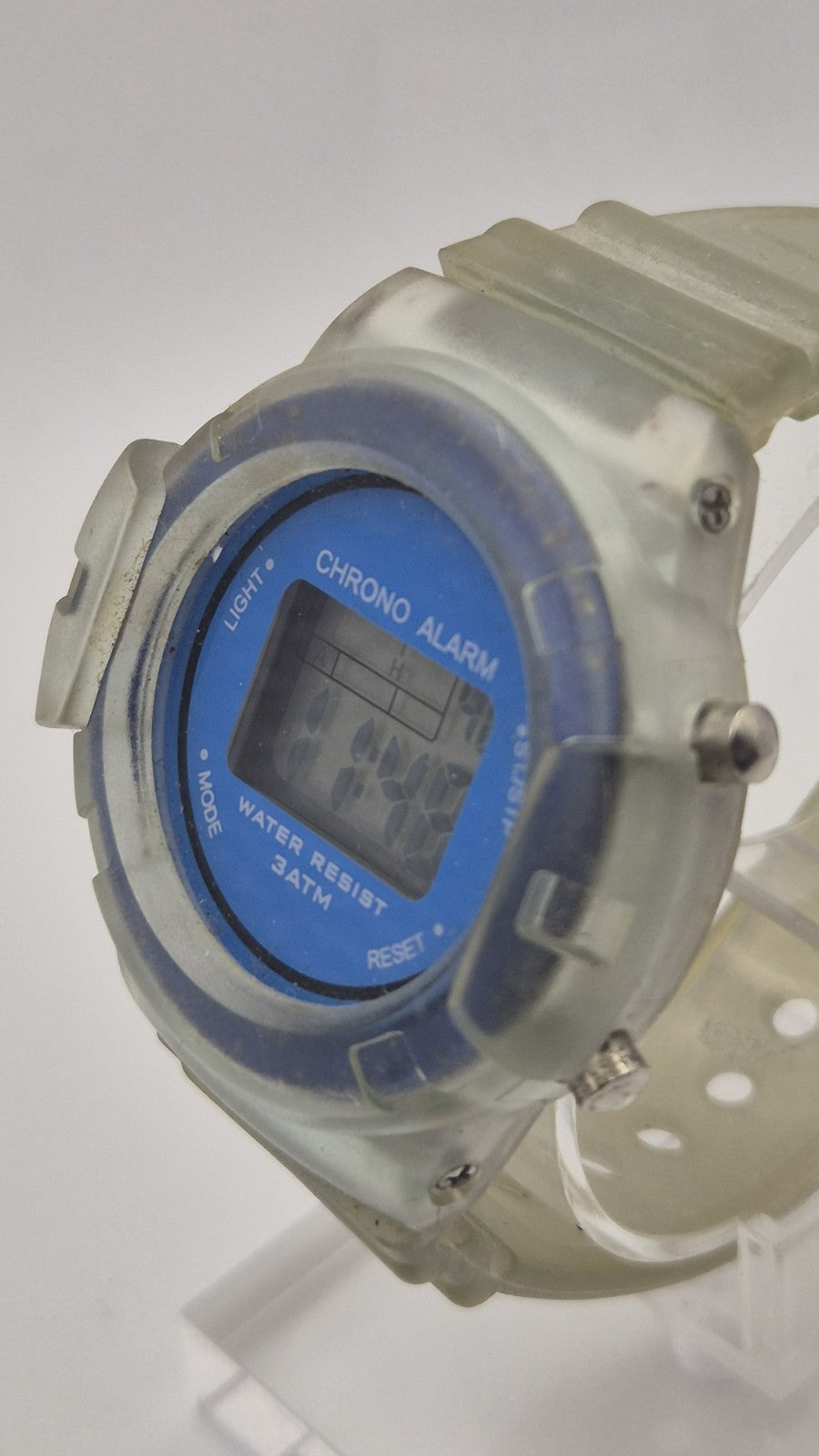 digital watch featuring a blue face and a transparent plastic strap7