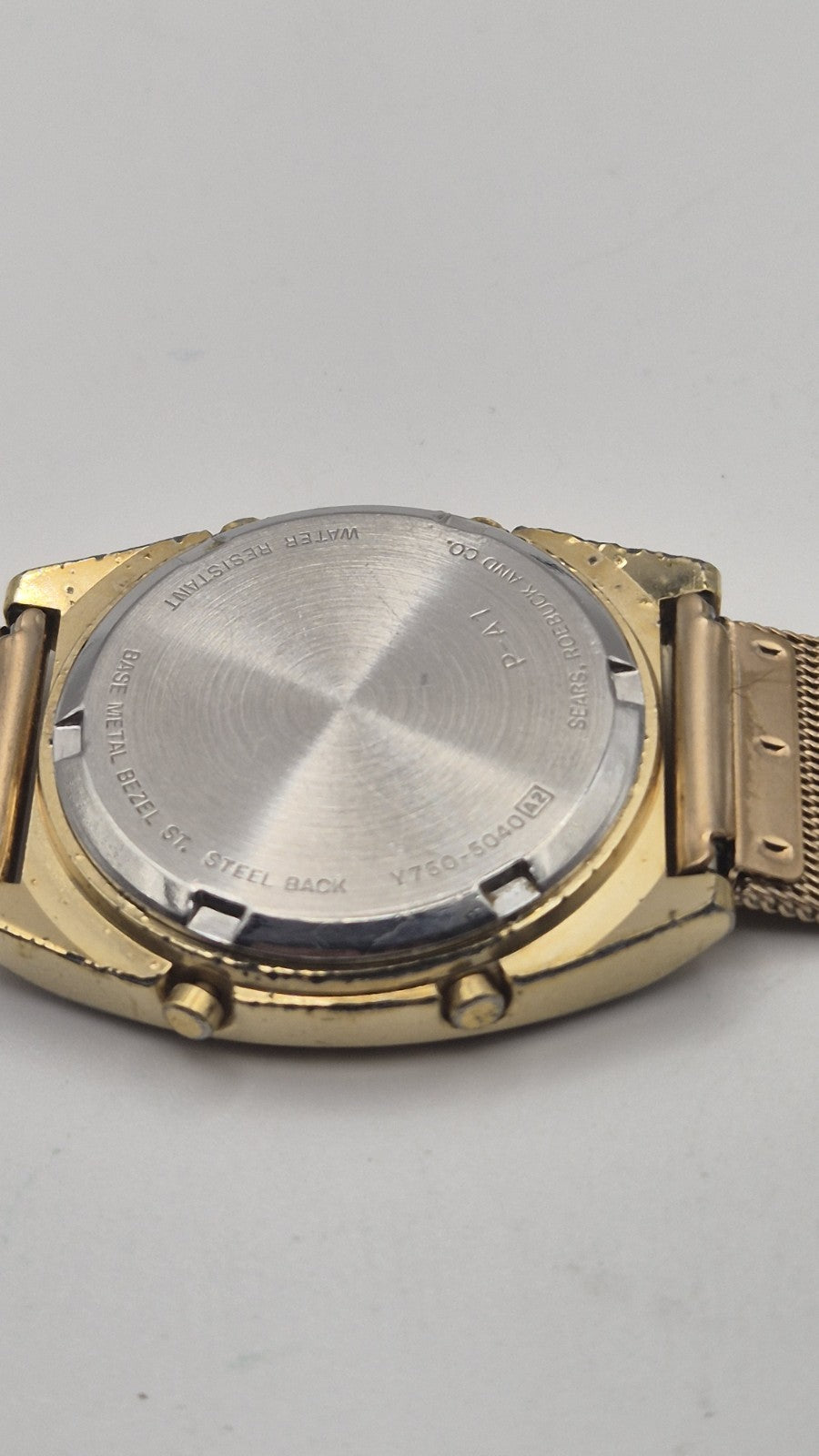 Phasar Quartz digital watch features a gold-tone metal case with wear on the...6