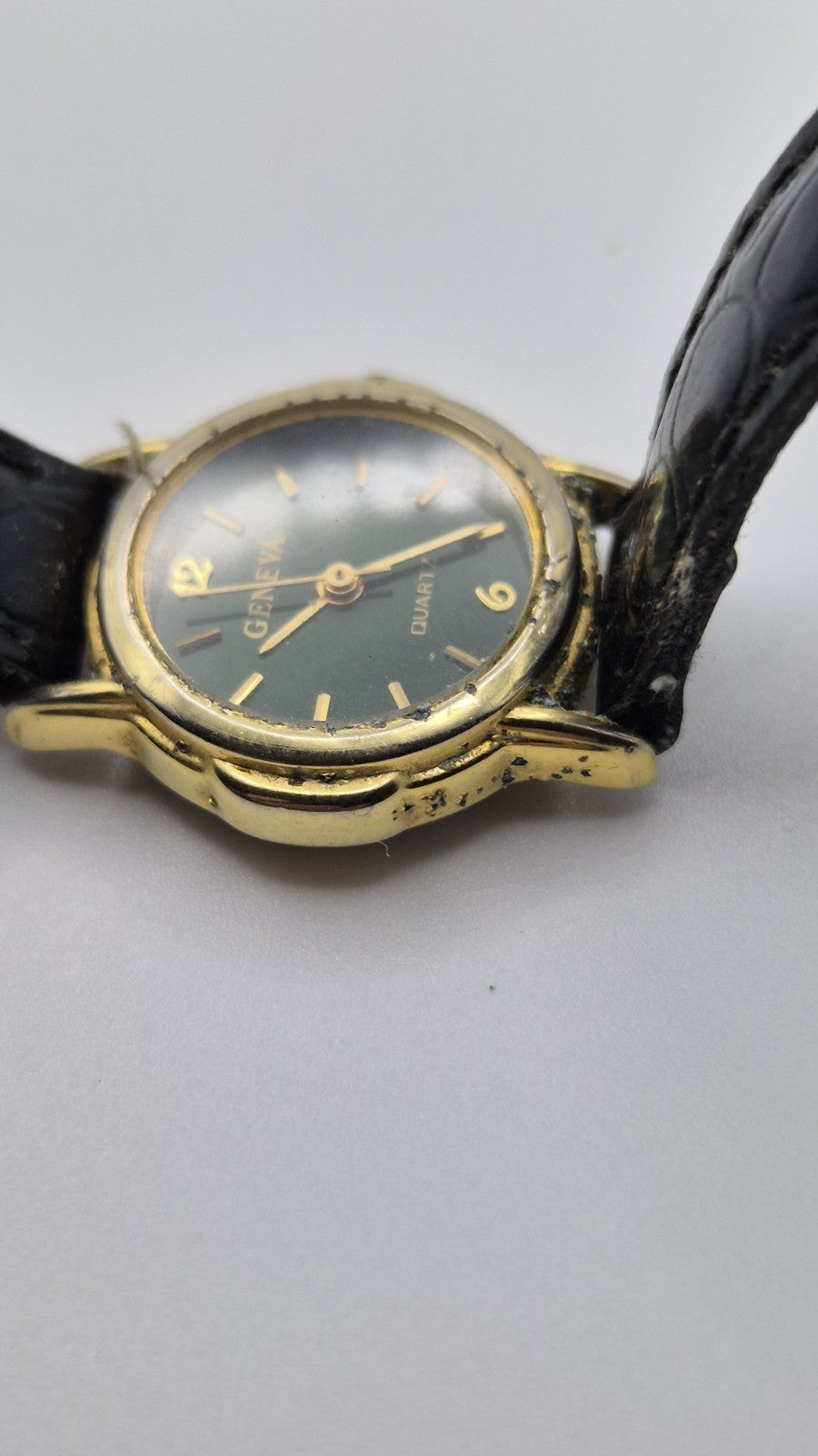 Geneva women's quartz watch with a green dial and goldtone case.1