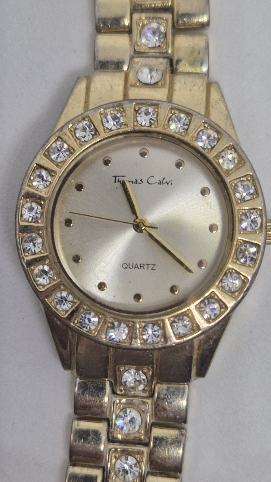 Thomas Calvi analog quartz wristwatch with a goldtoned band and a...0