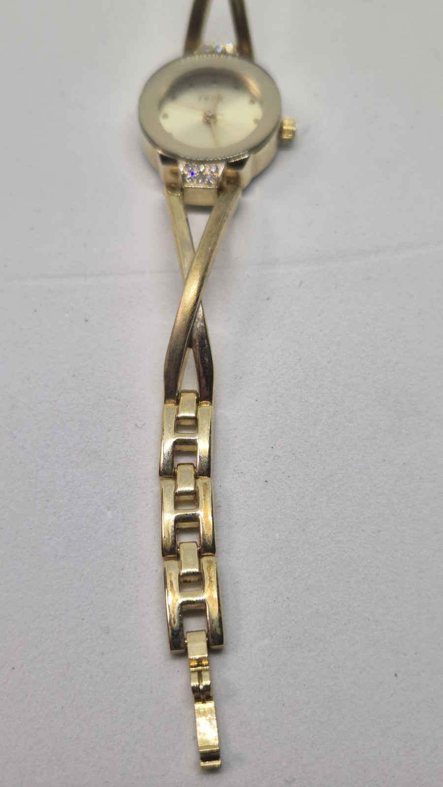 Next women's watch with a goldtone band and a crystalembellished case13