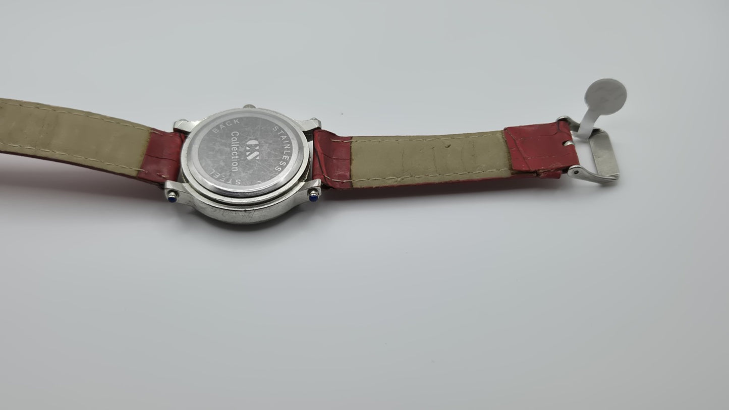 CS Collection Quartz watch with a red band and a crystalstudded bezel.10