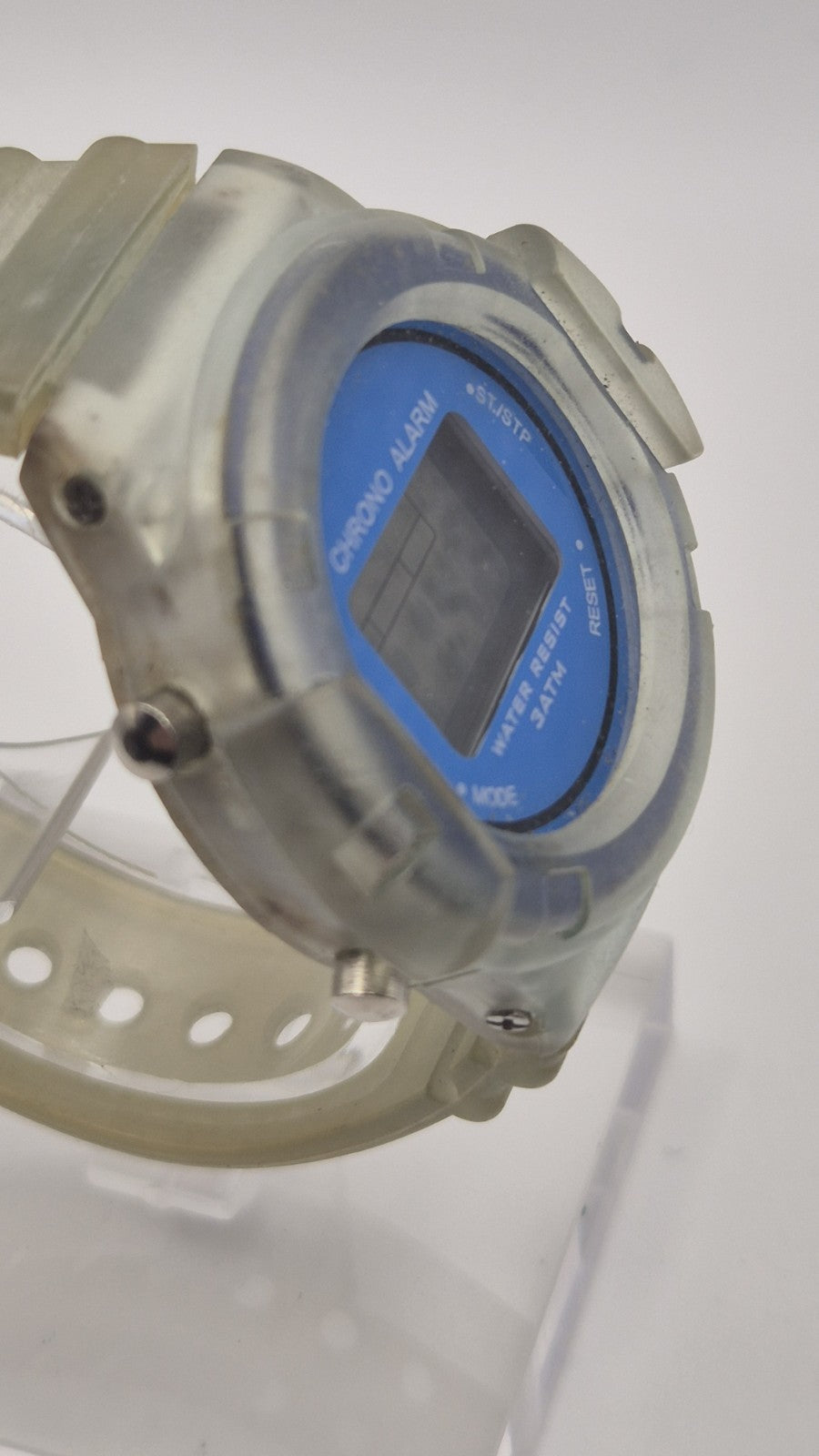 digital watch featuring a blue face and a transparent plastic strap3