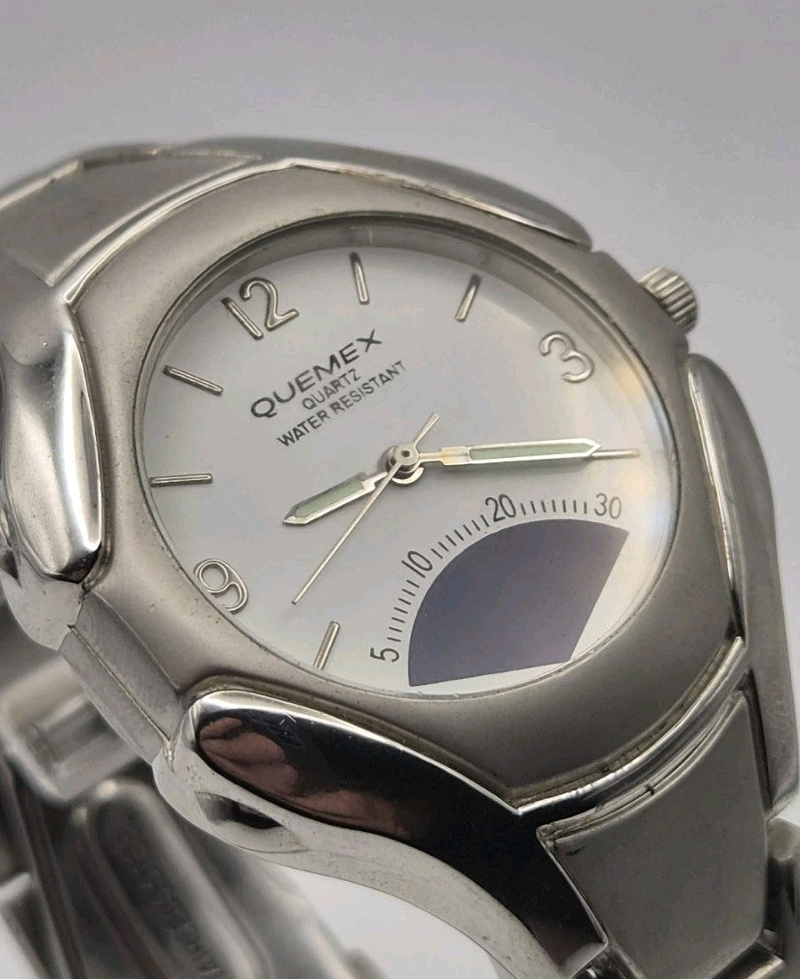 Mens Quemex quartz wristwatch with a silver-tone stainless steel case and...2