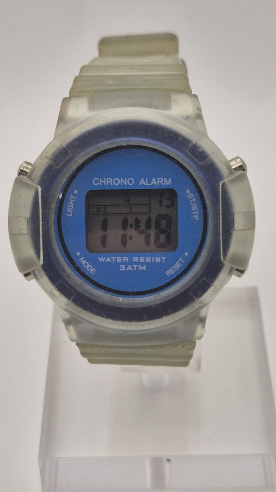 digital watch featuring a blue face and a transparent plastic strap1