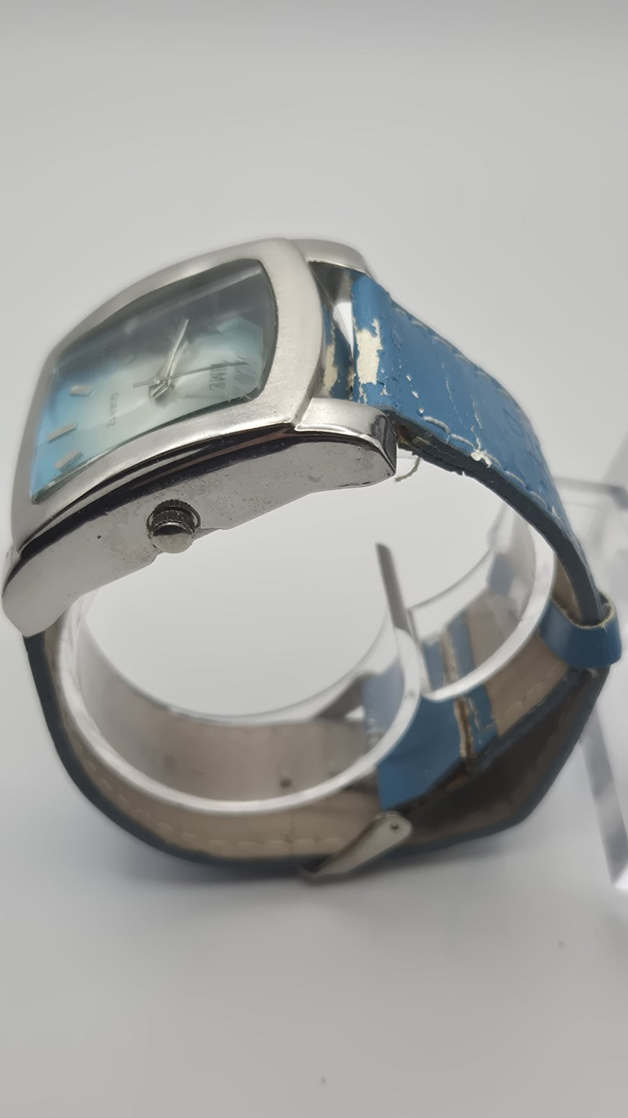 Diesel wristwatch features a rectangular stainless steel case and a blue dial...5