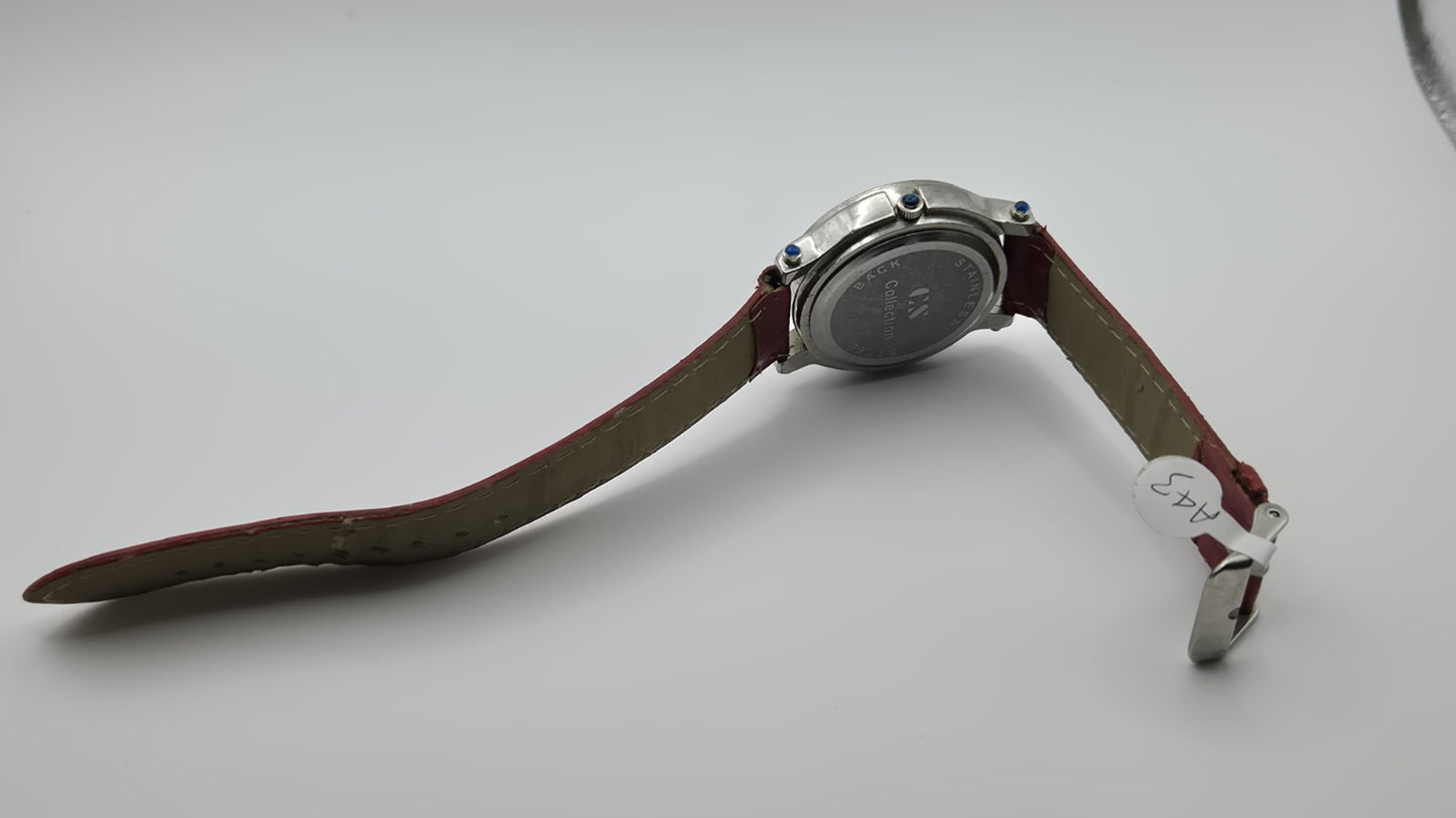 CS Collection Quartz watch with a red band and a crystalstudded bezel.4