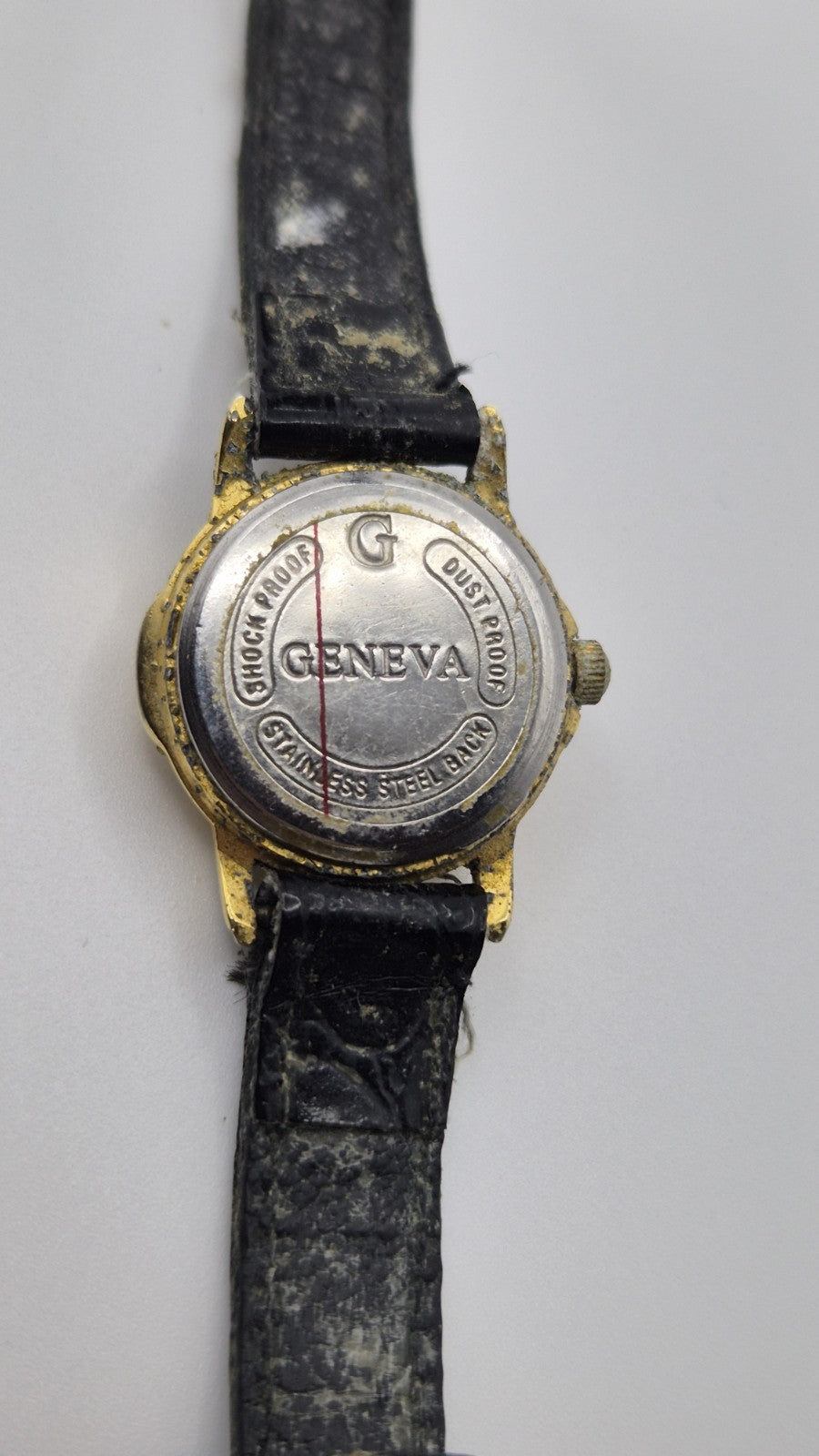 Geneva women's quartz watch with a green dial and goldtone case.9