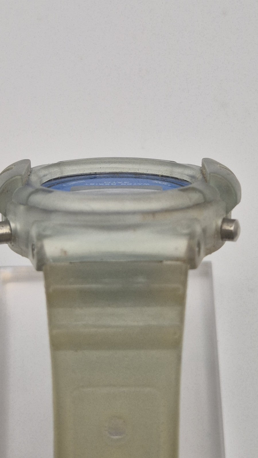 digital watch featuring a blue face and a transparent plastic strap5