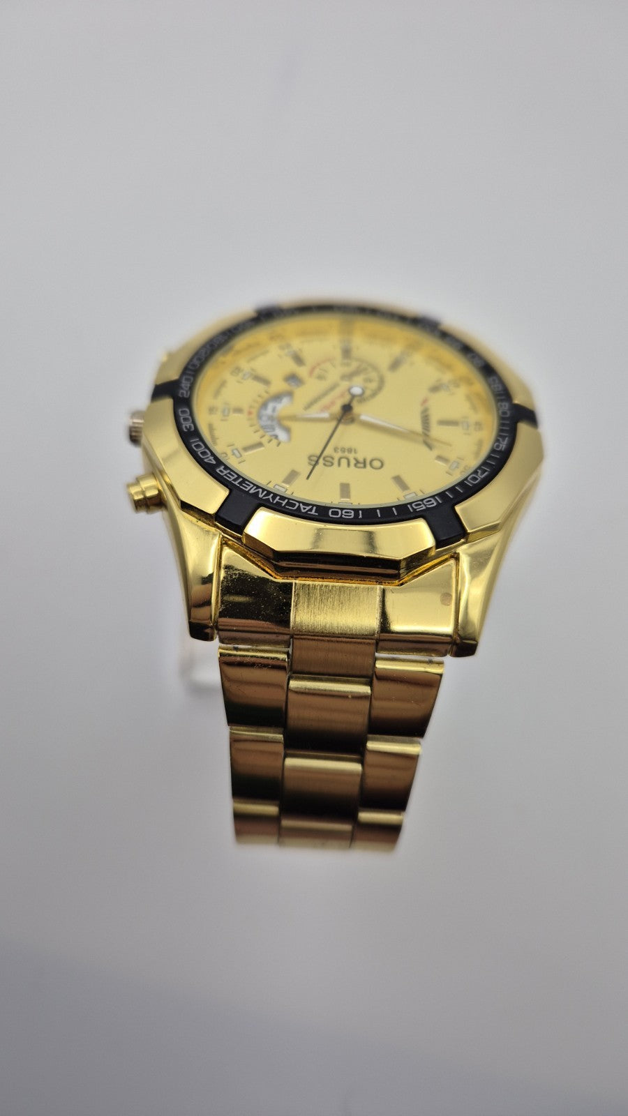 Oruss 1853 men's gold-tone quartz chronograph watch featuring a black tachymetre6