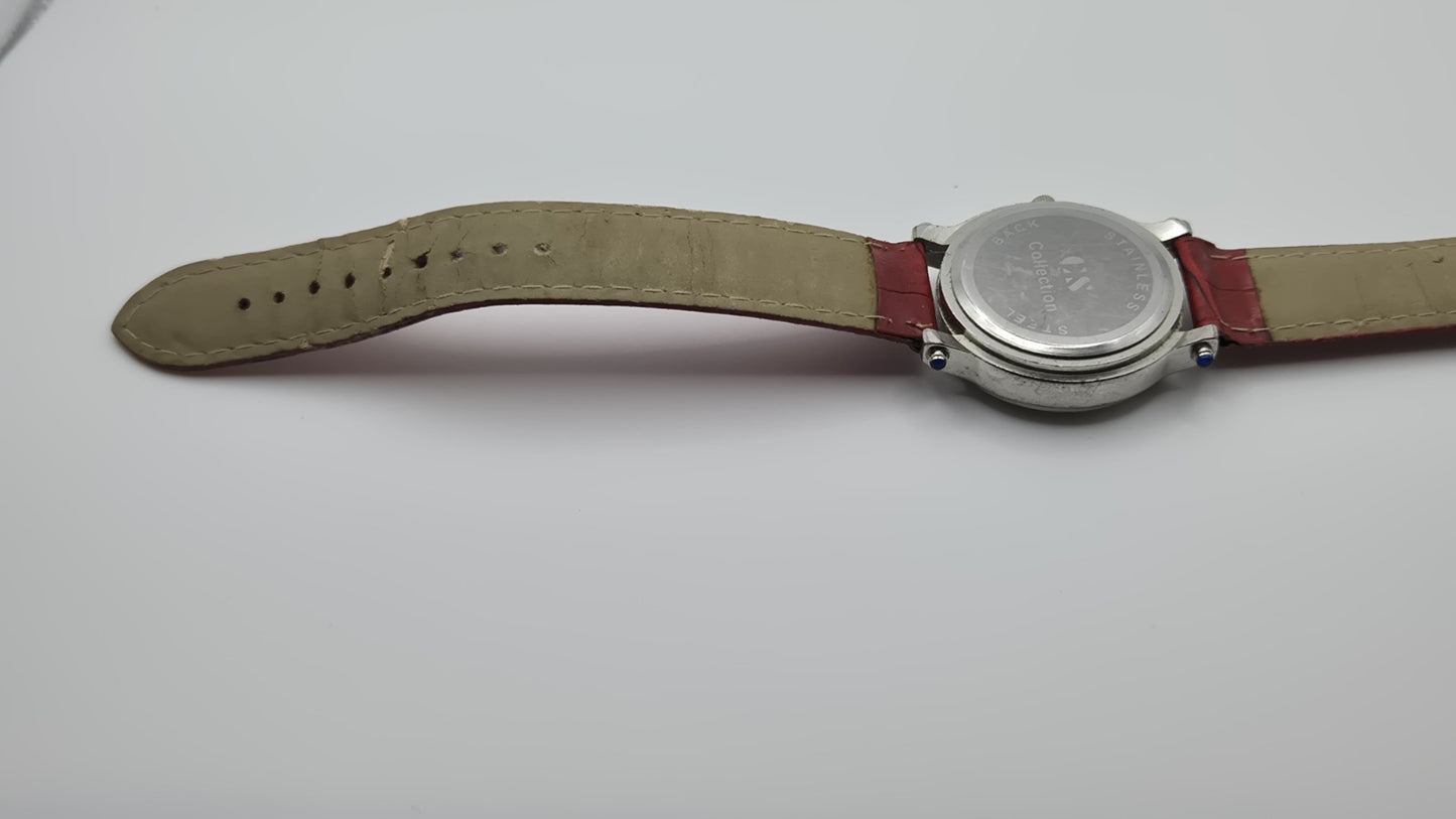 CS Collection Quartz watch with a red band and a crystalstudded bezel.9