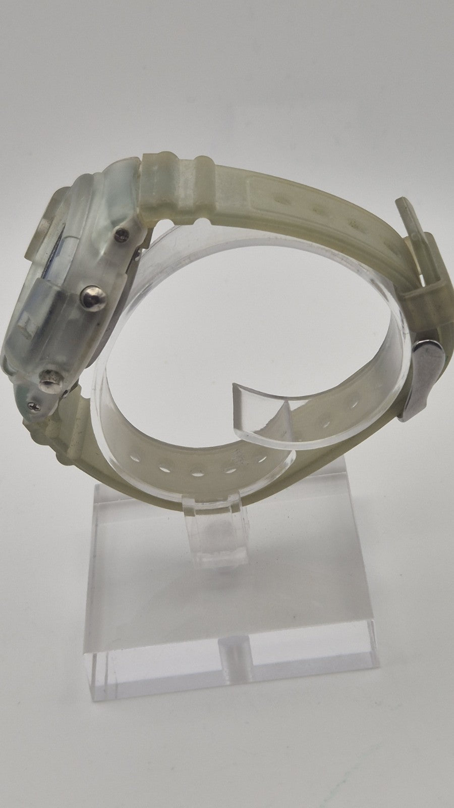 digital watch featuring a blue face and a transparent plastic strap6