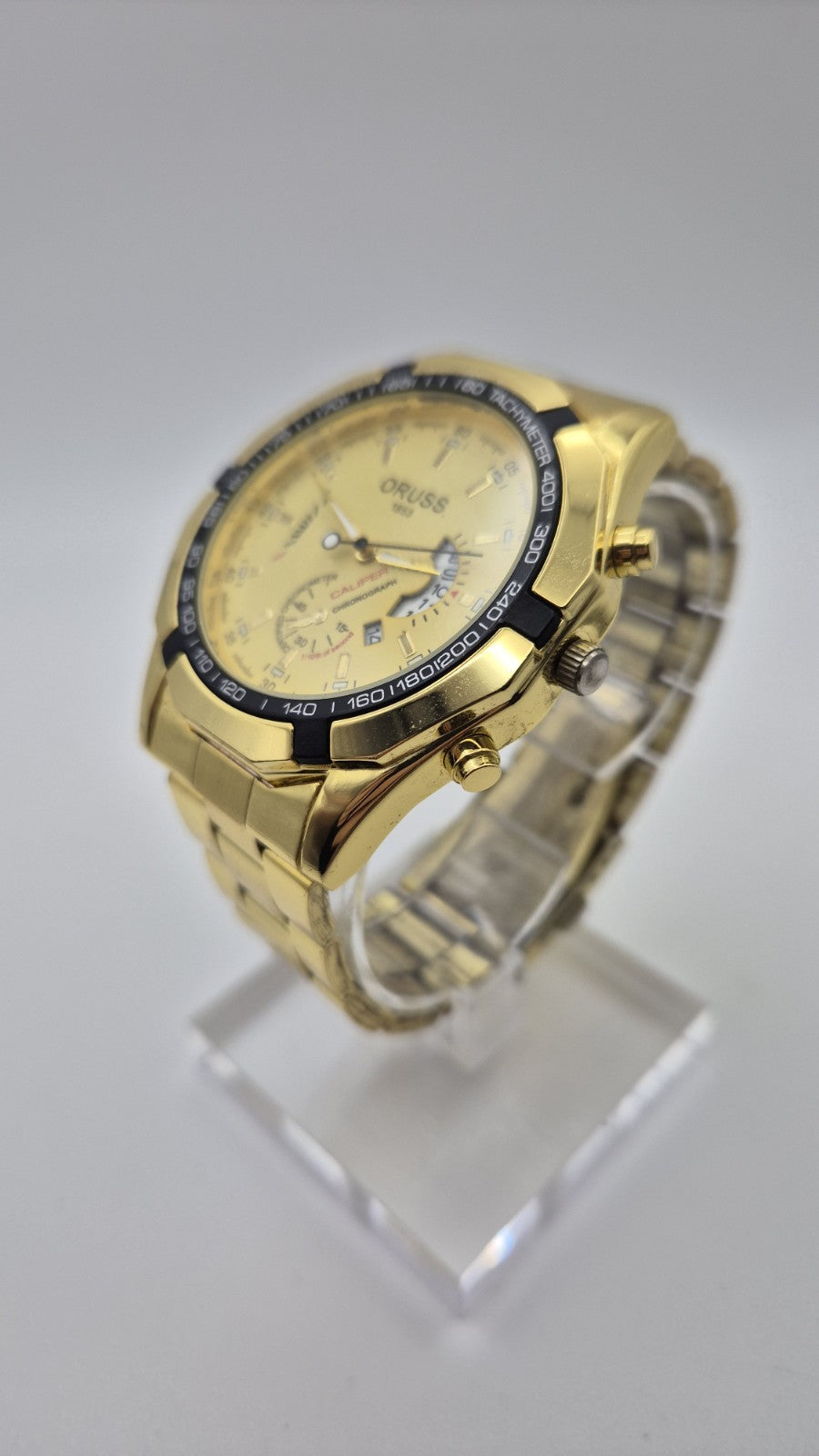 Oruss 1853 men's gold-tone quartz chronograph watch featuring a black tachymetre8