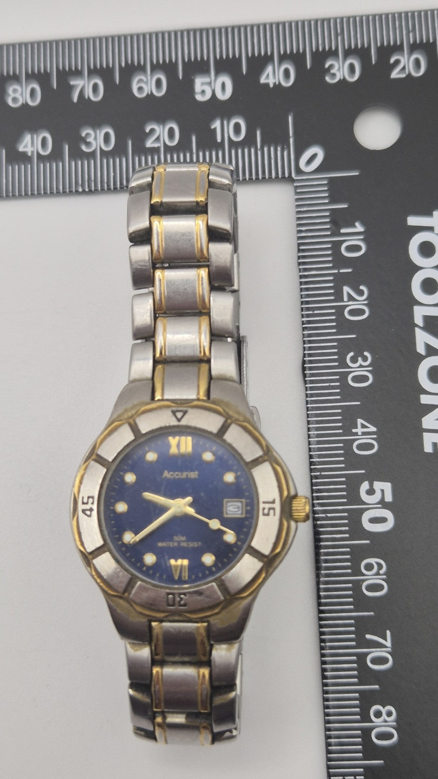 Accurist watch with a blue dial and two-tone bracelet.14