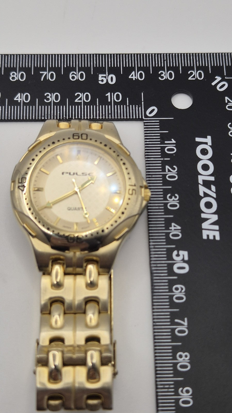 gold-toned Pulse brand watch22