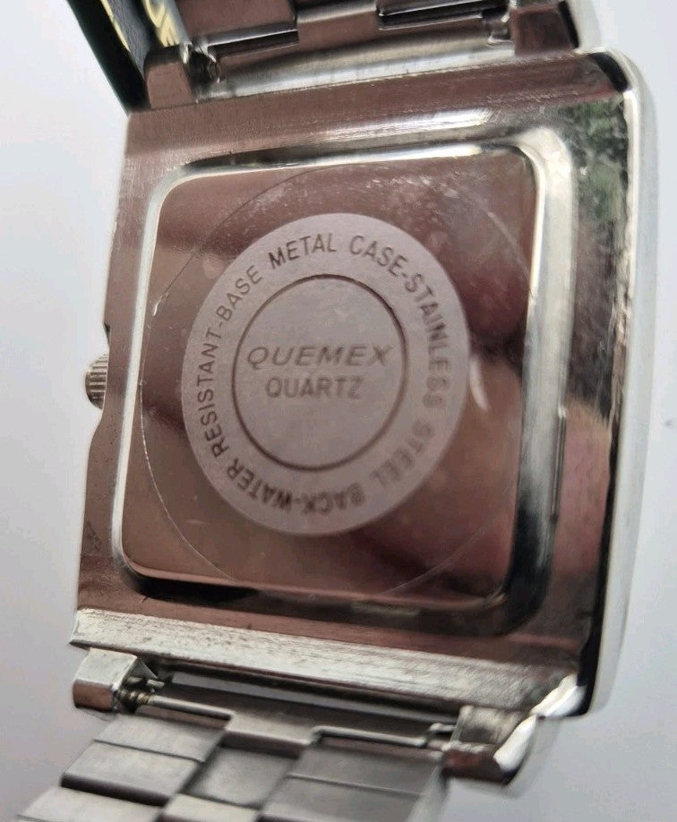 BNWT Quemex quartz Mens watch featuring a silver tone rectangular case and...9