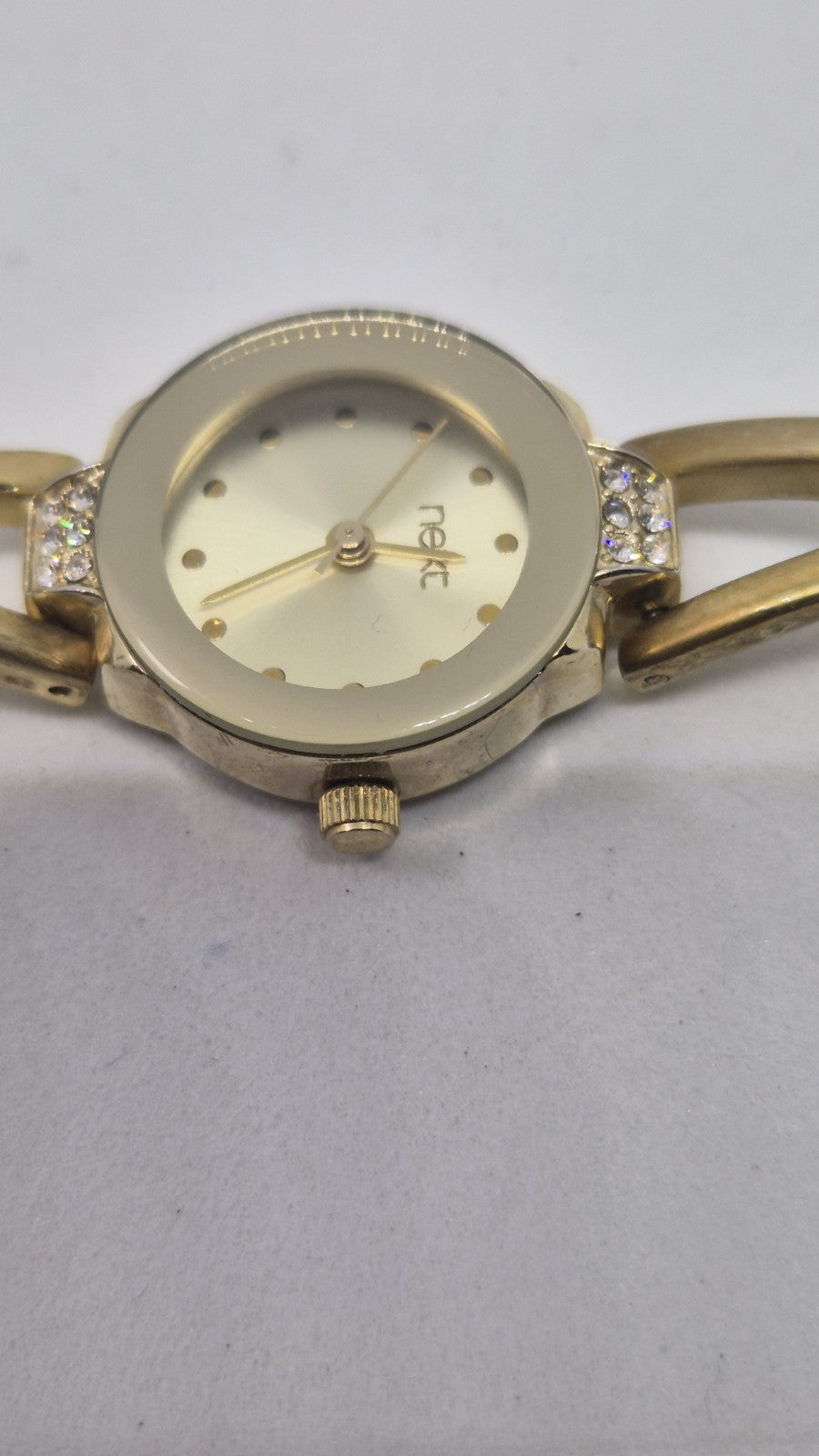 Next women's watch with a goldtone band and a crystalembellished case4